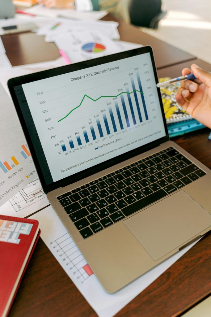 Increase Revenue Business 1 Outdoor Sports Adventure Website A close-up view of a laptop displaying business analytics and revenue charts.