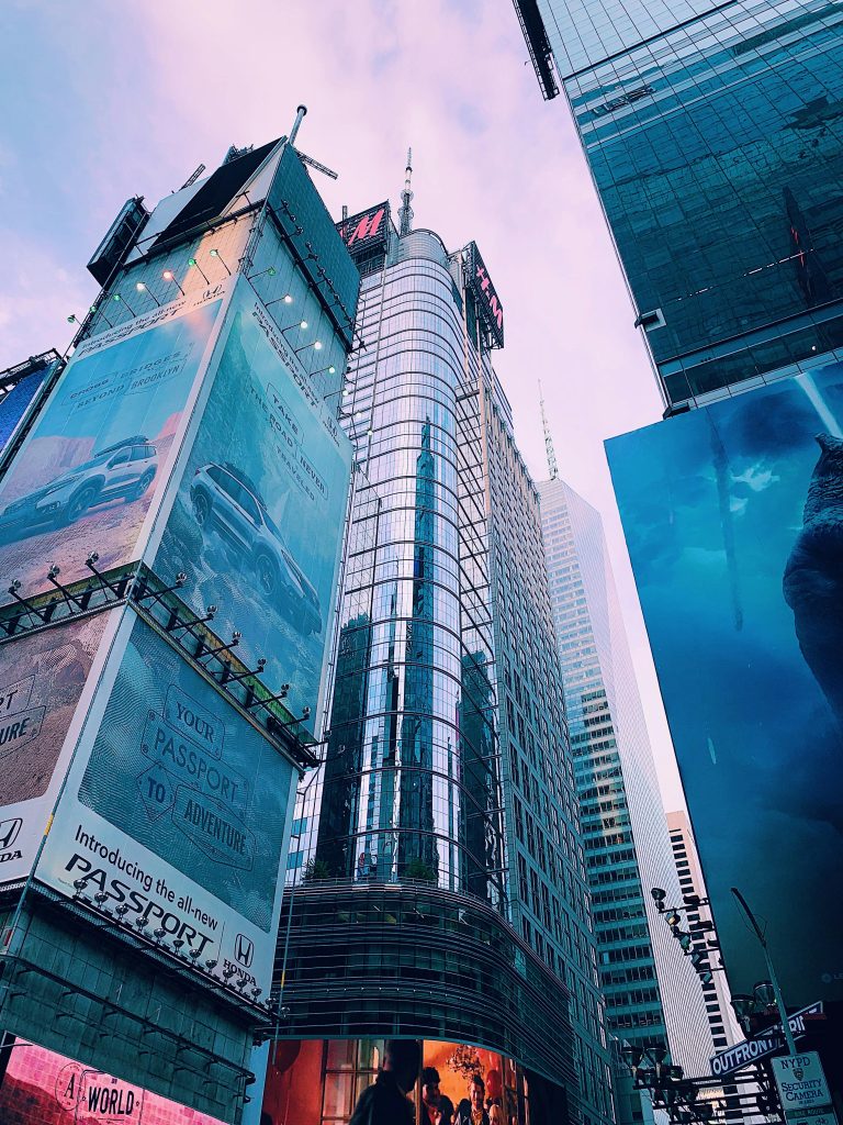 High Performing Ads for Business 1 Outdoor Sports Adventure Website Tall buildings with large advertisements showcasing impactful marketing strategies